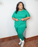 Plus size emerald green legging set with round neck top and fitted leggings front view