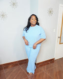 Side angle of plus size ribbed pant set showing relaxed fit and stretch