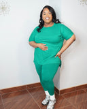 Front view of plus size green two piece set with relaxed top and stretchy leggings