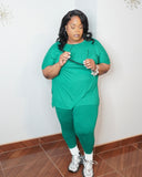 Side angle of plus size green legging set styled with sneakers casual look
