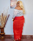 Side angle of plus size red fringe skirt showing layered fringe detail and movement