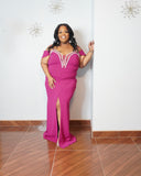 Curvy woman modeling elegant magenta plus size formal dress with rhinestone detailing