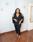 Side angle of plus size batwing top showing draped silhouette