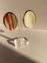 Soléa Luxe oversized oval statement earring in blush pink with cream stripes and polished gold-tone setting displayed on mannequin