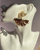 Textured gold fan drop earring featuring sculptural spiral stud and delicate white pearl-like accents from Lysaire