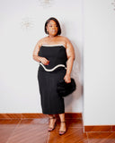 Plus-size model wearing LYSAIRE Celeste black strapless corset midi dress with sparkling silver-tone trim.