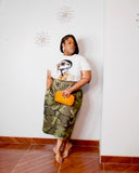 Lysaire plus size camo wide leg pants styled with white graphic tee gold chain belt and orange clutch