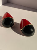 Rouge Noir two-tone red and black sculptural statement earrings with polished gold-tone detailing