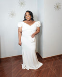 Plus size white mermaid dress with dramatic ruffle sleeves