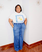 Plus size woman wearing soft stretch denim drawstring wide leg pants with elastic waist and pockets