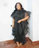 Curvy woman wearing luxury black evening dress
