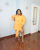 Plus size orange mini shirt dress with waist tie detail side pose