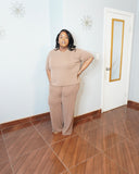 Side angle of plus size ribbed pant set showing relaxed fit and stretch