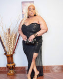 Plus size black sequin high low halter dress with sheer overlay and thigh slit front view