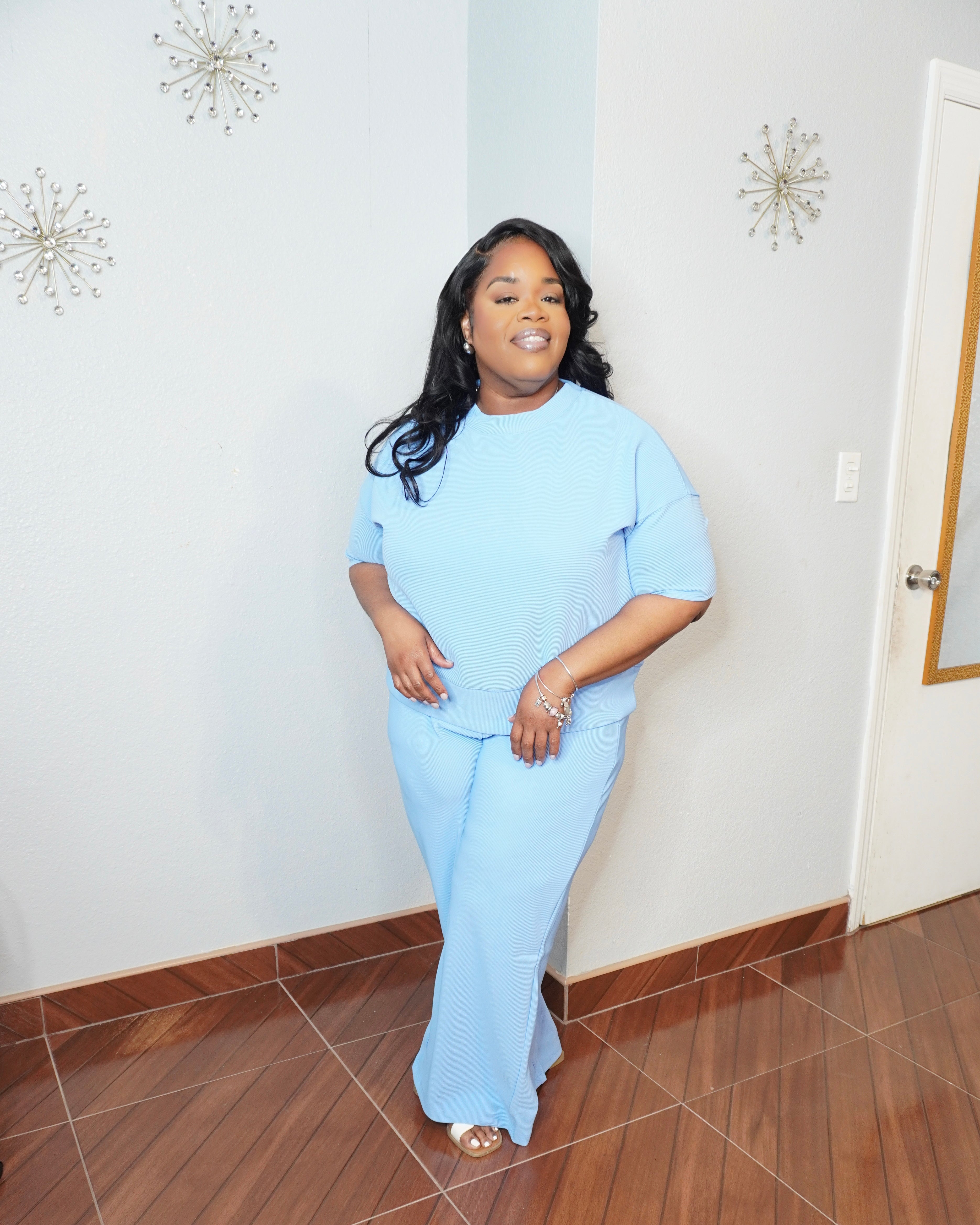 Side angle of plus size ribbed pant set showing relaxed fit and stretch