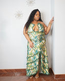 Curvy woman wearing green tropical plus size maxi dress