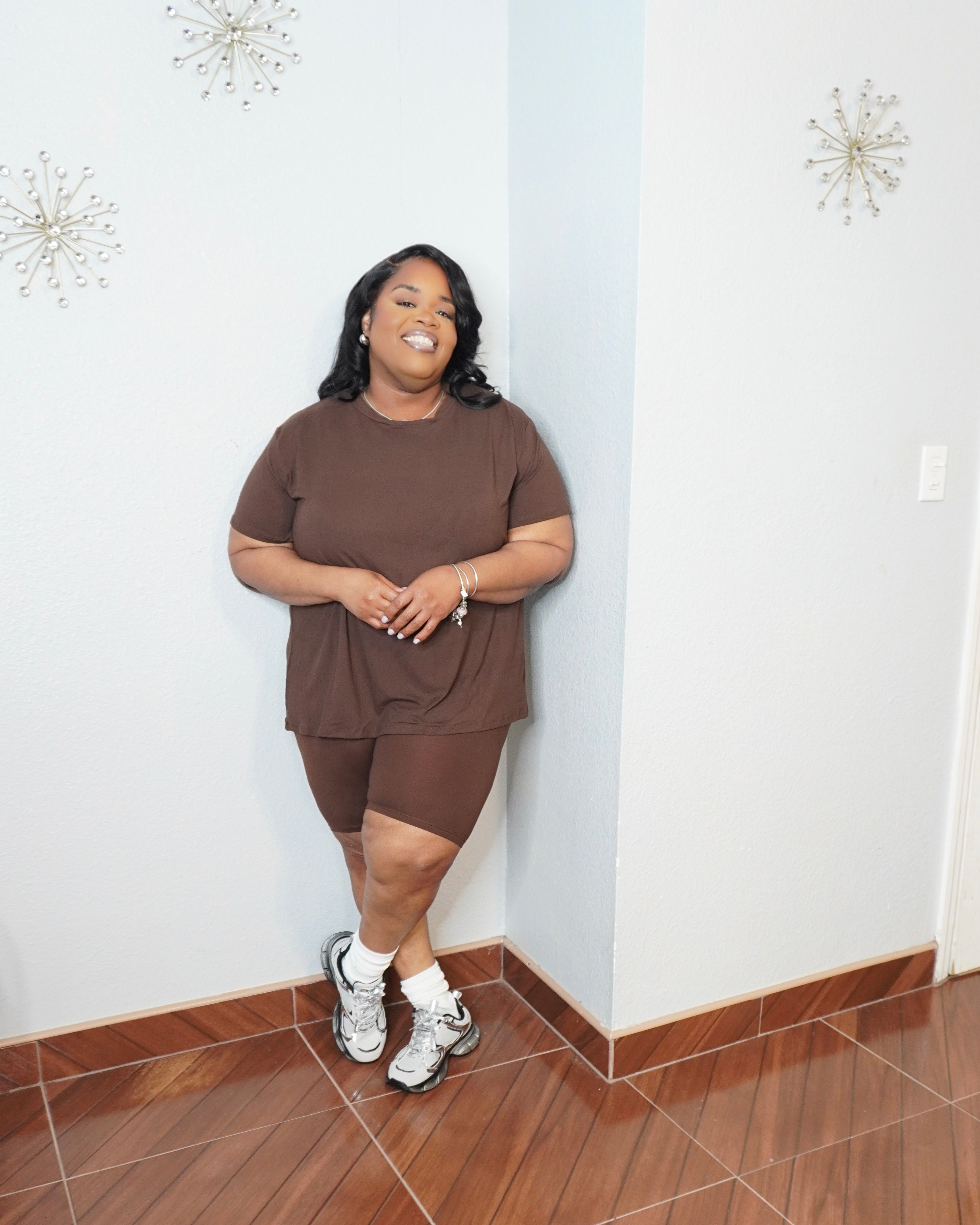 Plus size woman smiling in chocolate brown lounge short set