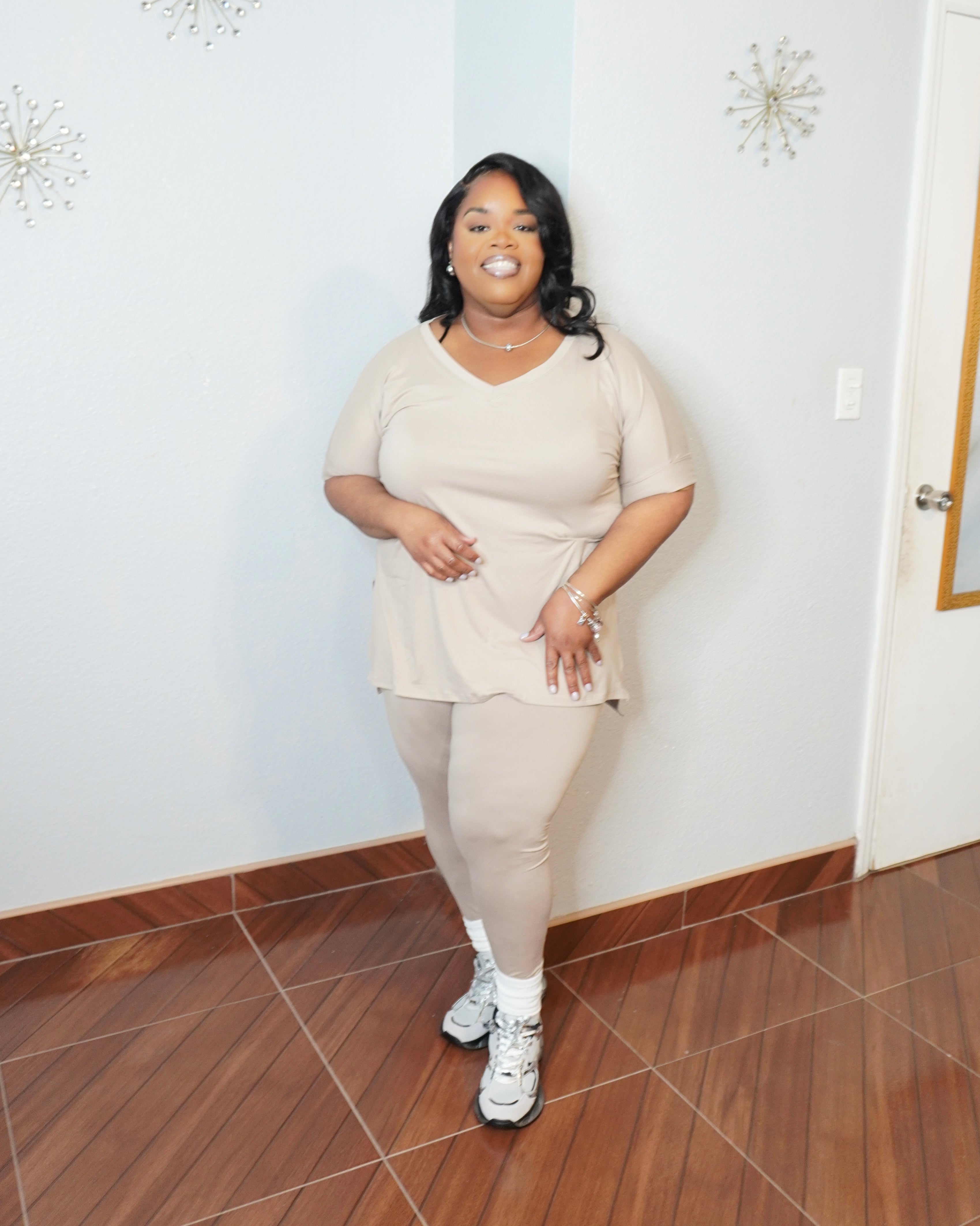 Close front view of plus size V-neck top with smooth stretch fabric