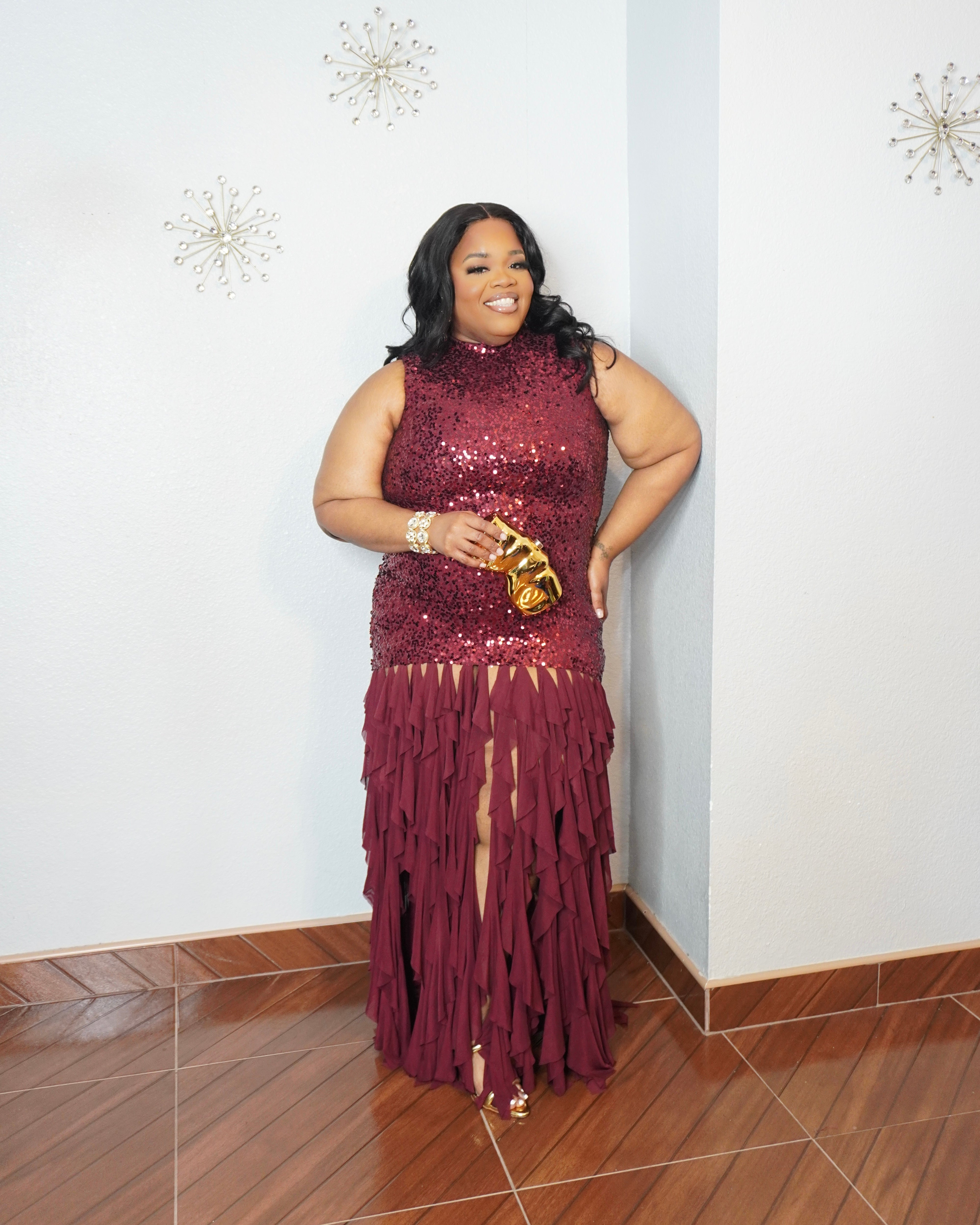 Back view of black sequin maxi dress with layered chiffon skirt