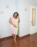 Plus size model wearing two tone pink and green stretch midi dress front view