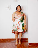 Curvy woman wearing tropical print bubble hem dress