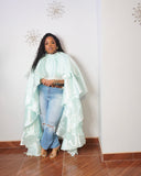 Plus size cascading statement blouse styled with jeans and leopard print belt