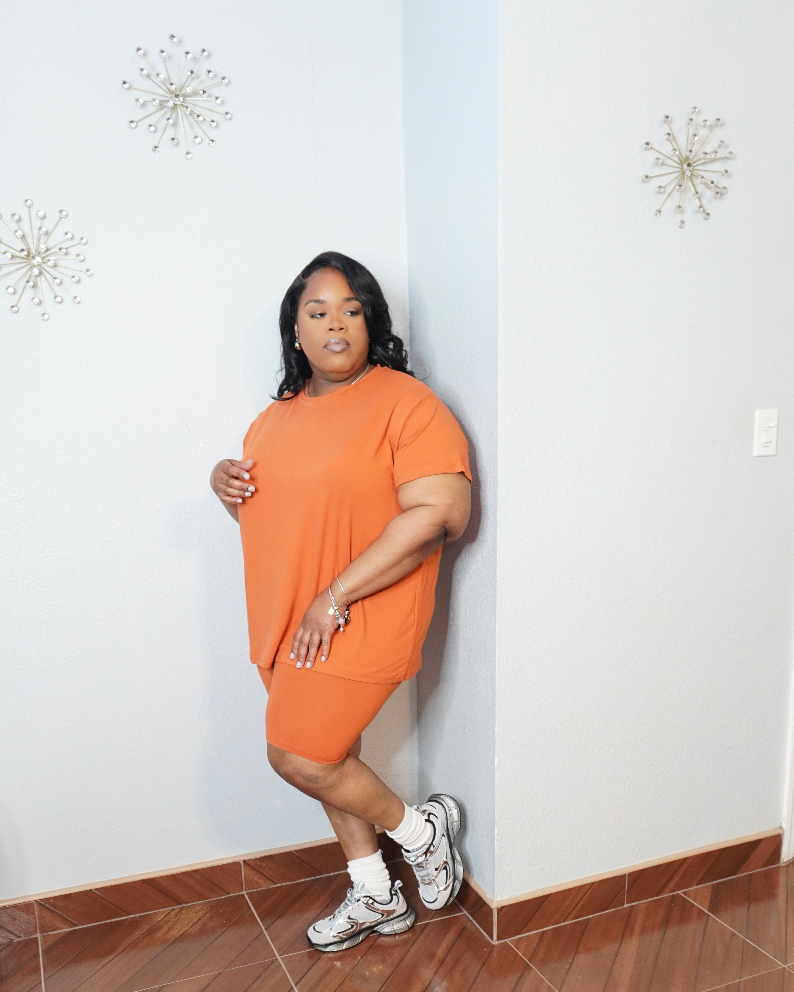 Front view of burnt orange lounge set on plus size model