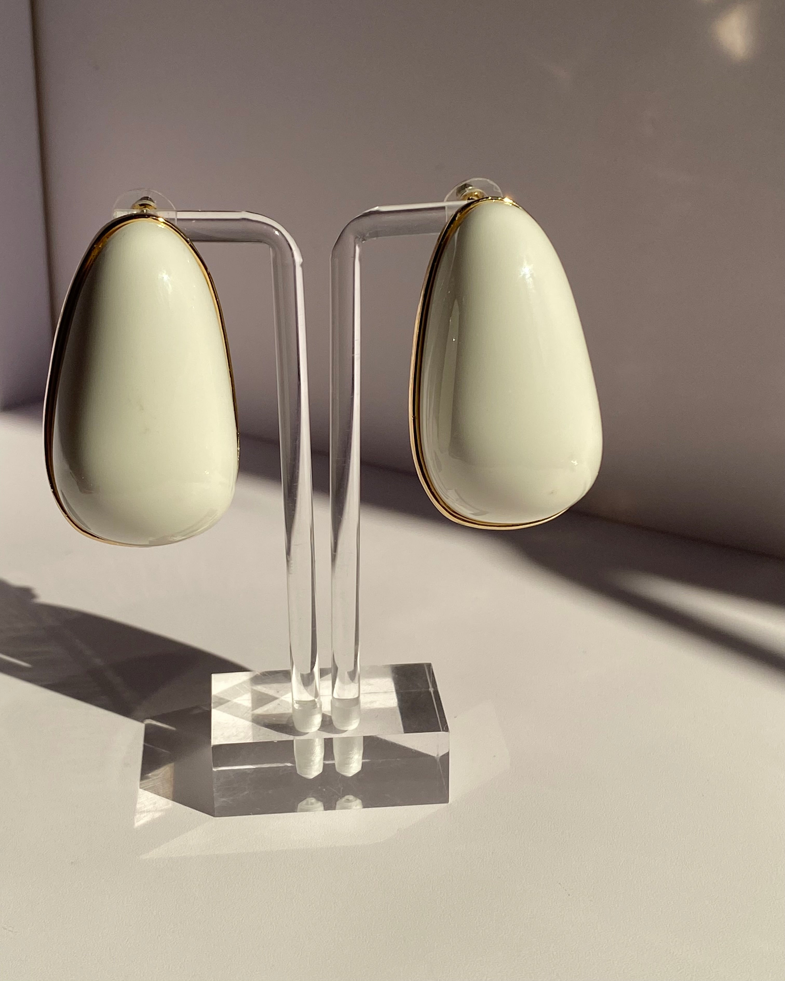 Black and ivory oversized teardrop statement stud earrings with gold-tone borders available at Lysaire