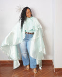Plus size mint statement top with dramatic flowing satin-look layers and stretchy base