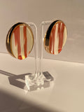Elegant ivory oval statement stud earrings with glossy cream centers and vintage-inspired gold-tone settings