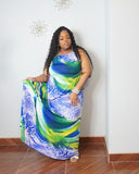 Curvy woman wearing elegant tropical resort wear maxi dress