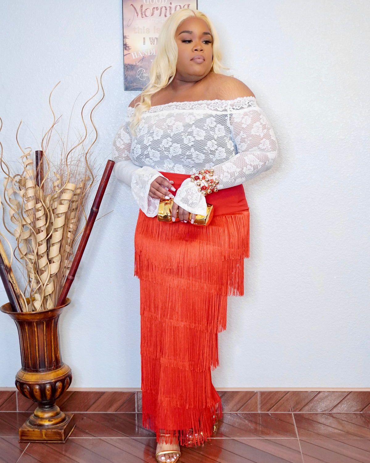 Plus size red fringe maxi skirt styled with lace top and heels front view