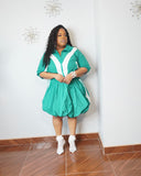 Curvy woman wearing green plus size bubble skirt matching set