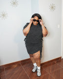 Front view of plus size two piece skirt set with shoulder pads and ruched detail