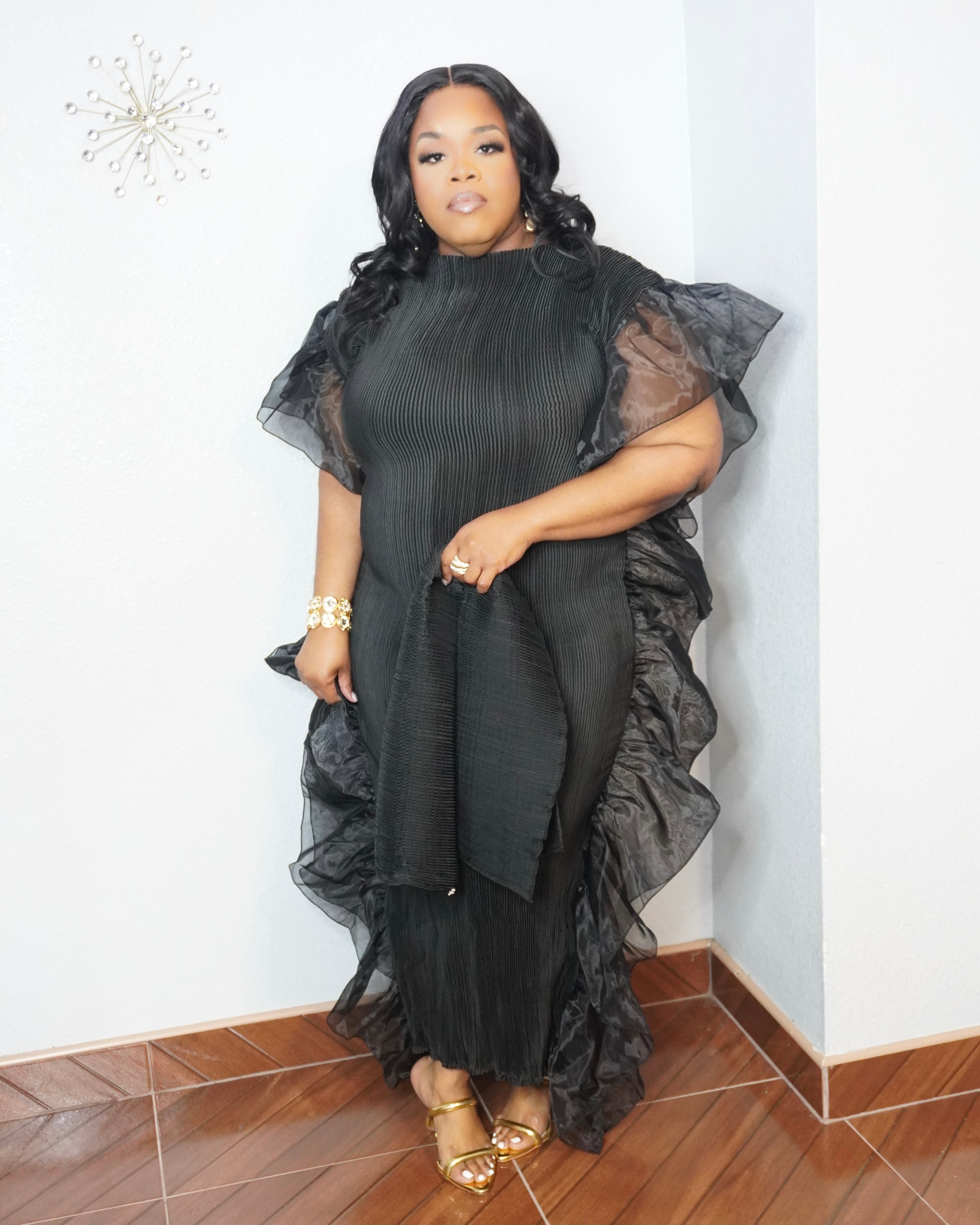 Curvy woman wearing luxury black evening dress