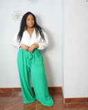 Plus size tall-friendly orange wide-leg pants styled with colorful blouse