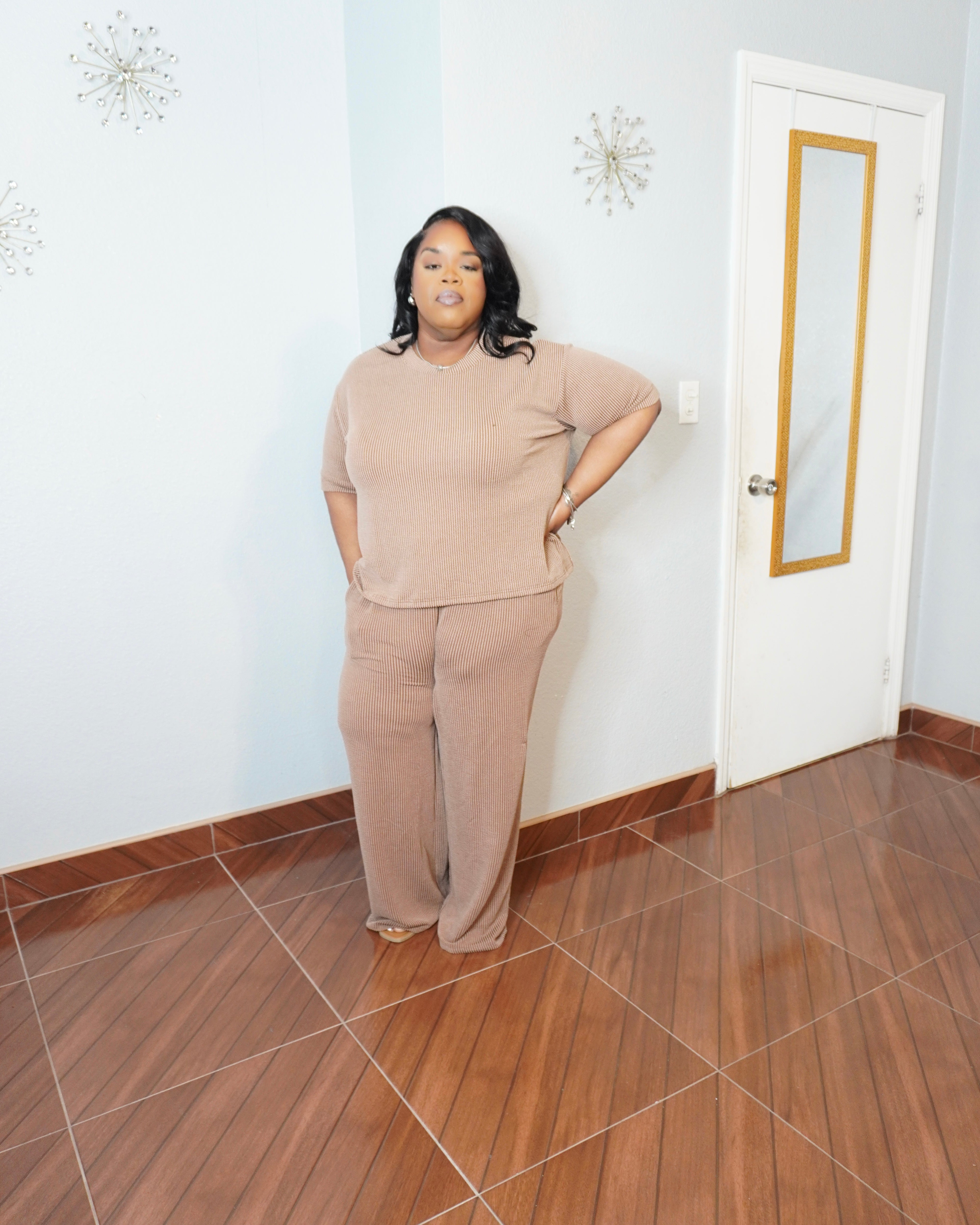 Side angle of plus size ribbed pant set showing relaxed fit and stretch