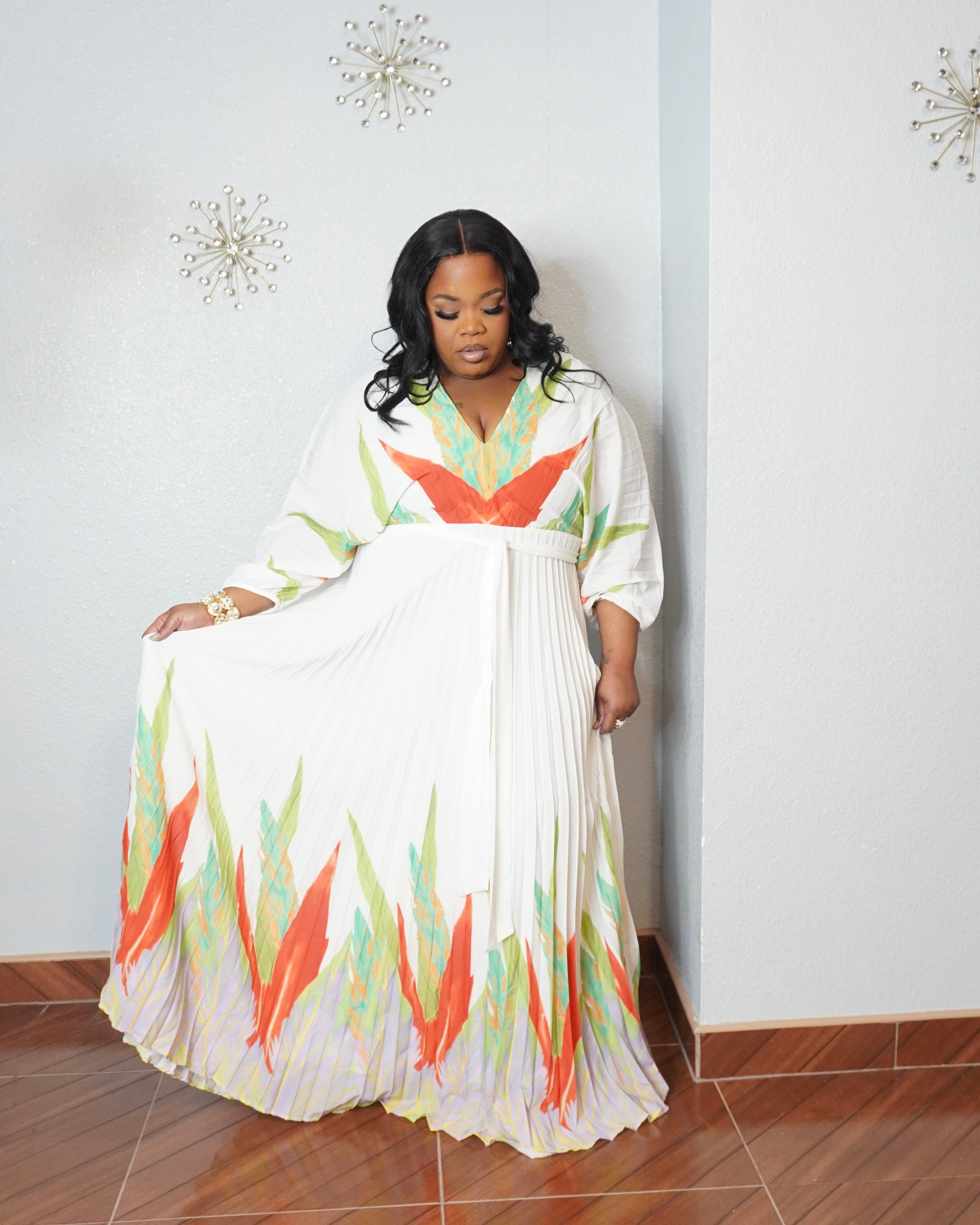 Curvy woman modeling elegant tropical print vacation maxi dress