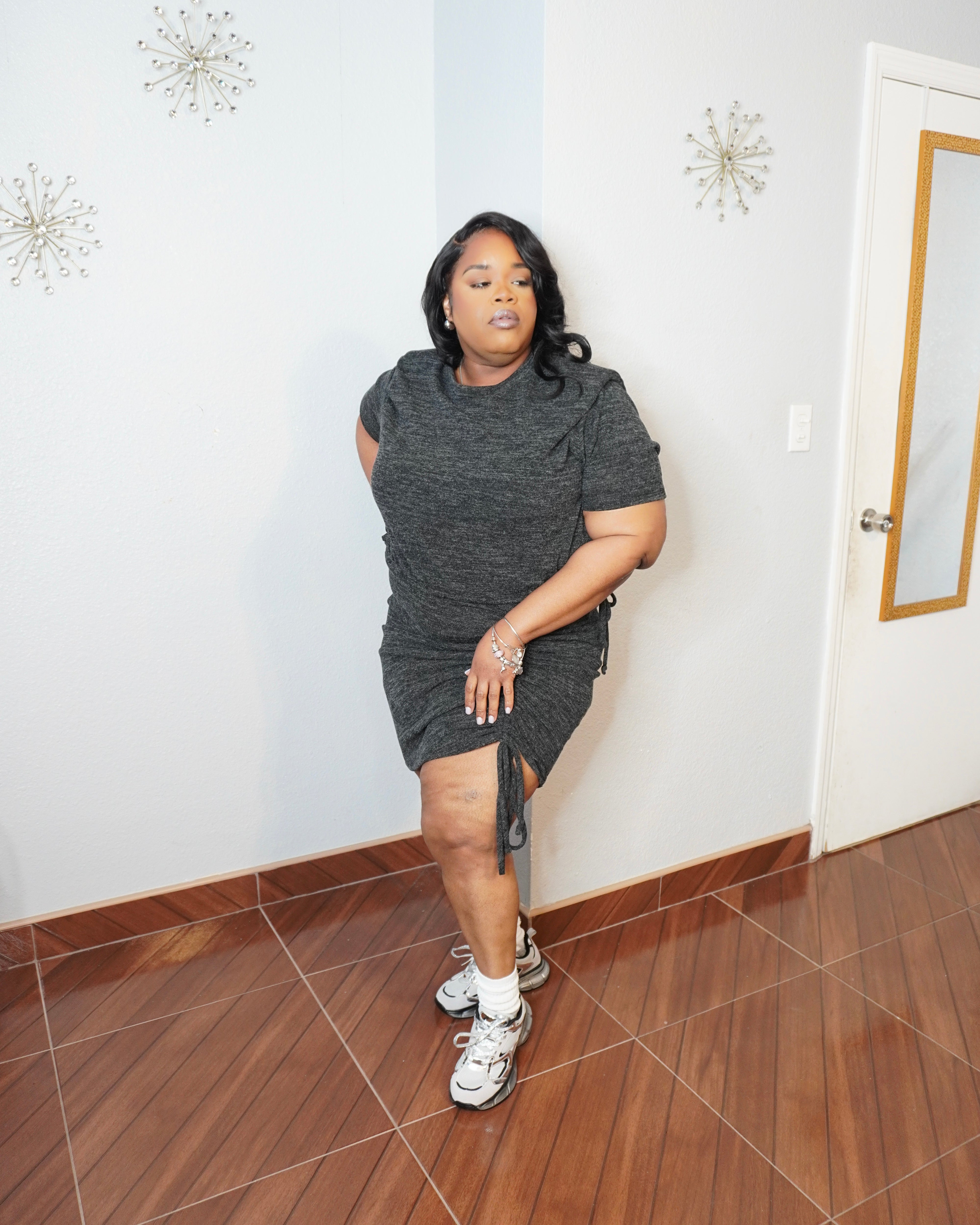 Side angle of plus size skirt set showing adjustable ruching and fitted silhouette